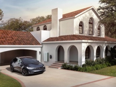 Solar Roof with your Tesla vehicle in the driveway.