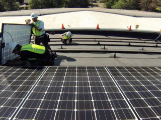 The solar installation in full swing on the Emerson roof in downtown Bozeman