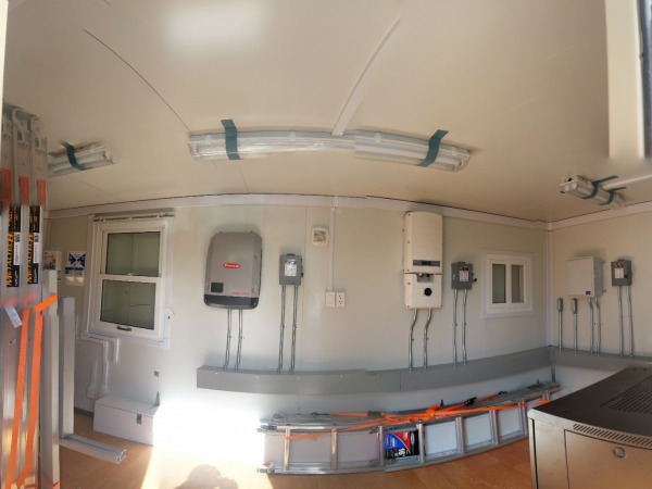 The inside of the training lab, showing three of the four inverter systems